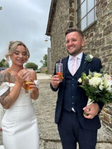 Bride and groom enjoying a drink following the ceremony