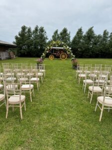 View of the ceremony area, showing chairs and archway
