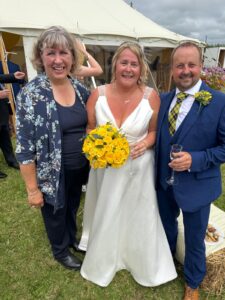 smiling bride and groom with their celebrant Nicola